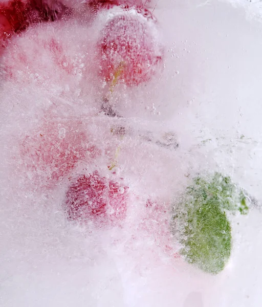 Small Red Plums Frozen Block Ice — Stock Photo, Image