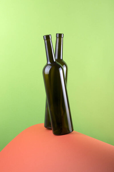 Abstract still life with color background and two glass bottles