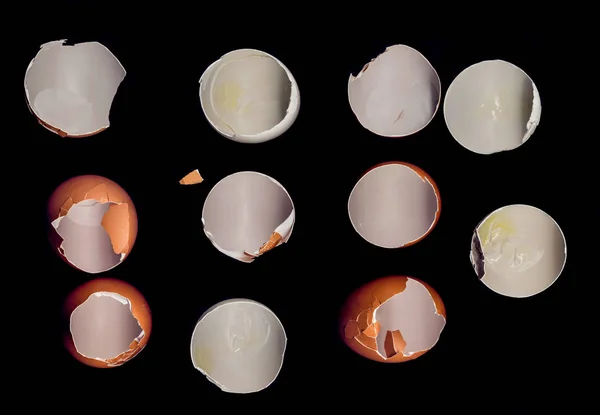 Broken Eggshell on a black background, top view