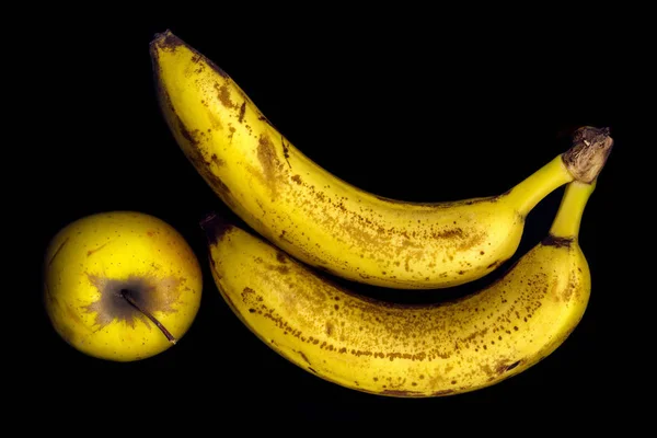 Duas Bananas Maduras Maçã Fundo Preto — Fotografia de Stock