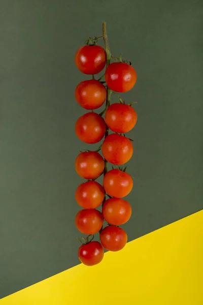 Ripe Red Cherry Tomatoes on Colored Background