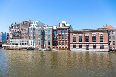 Amsterdam, Netherlands - July 02, 2018: View of the Amstel River embankment in the center of Amsterdam