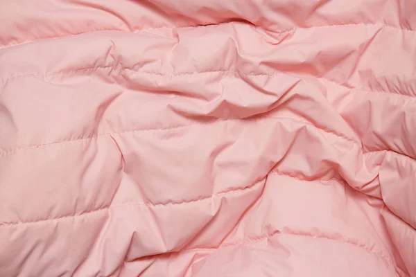 Концепція текстилю та текстури. Крупним планом рожевий тканинний фон — стокове фото
