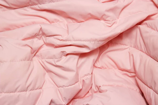 Tekstil ve doku kavramı. Pembe kumaş arka planı kapat