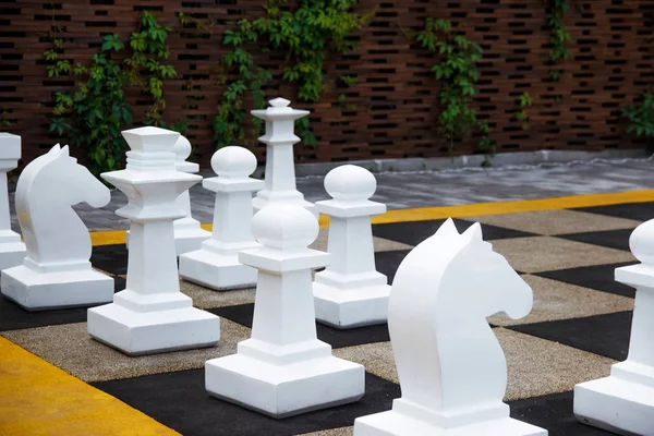 Giant chess, street game. Play chess in the street.