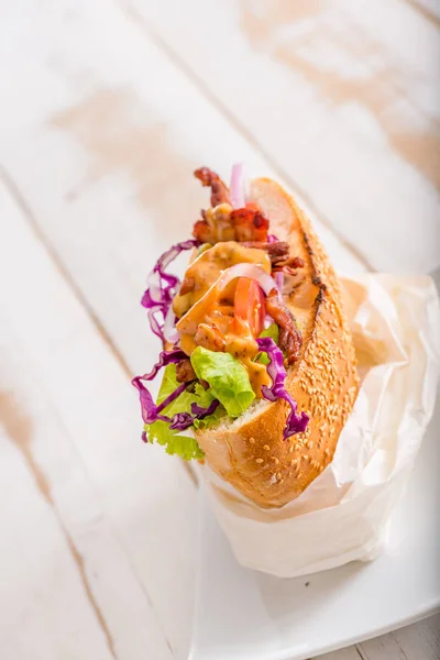 close up of Turkish kebab sandwich on white wooden background