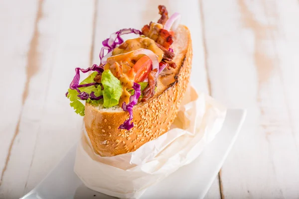 close up of Turkish kebab sandwich on white wooden background