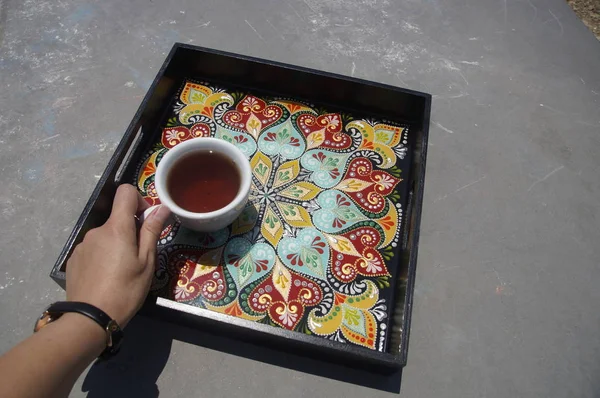 black square hand-painted tray with contour acrylic paints in the technique point to point, with a geometric pattern in the form of a mandala