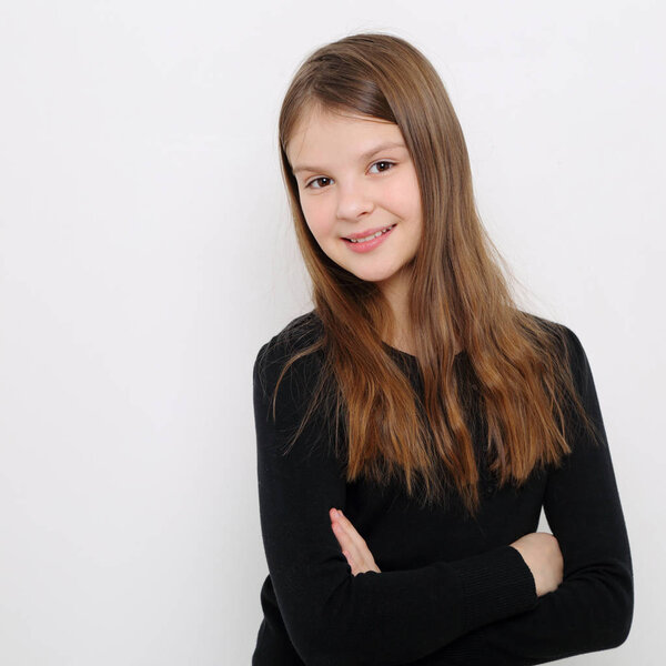 Studio image of lovely emotional caucasian teen girl