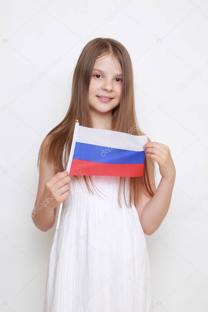 Cute little girl and Russian flag