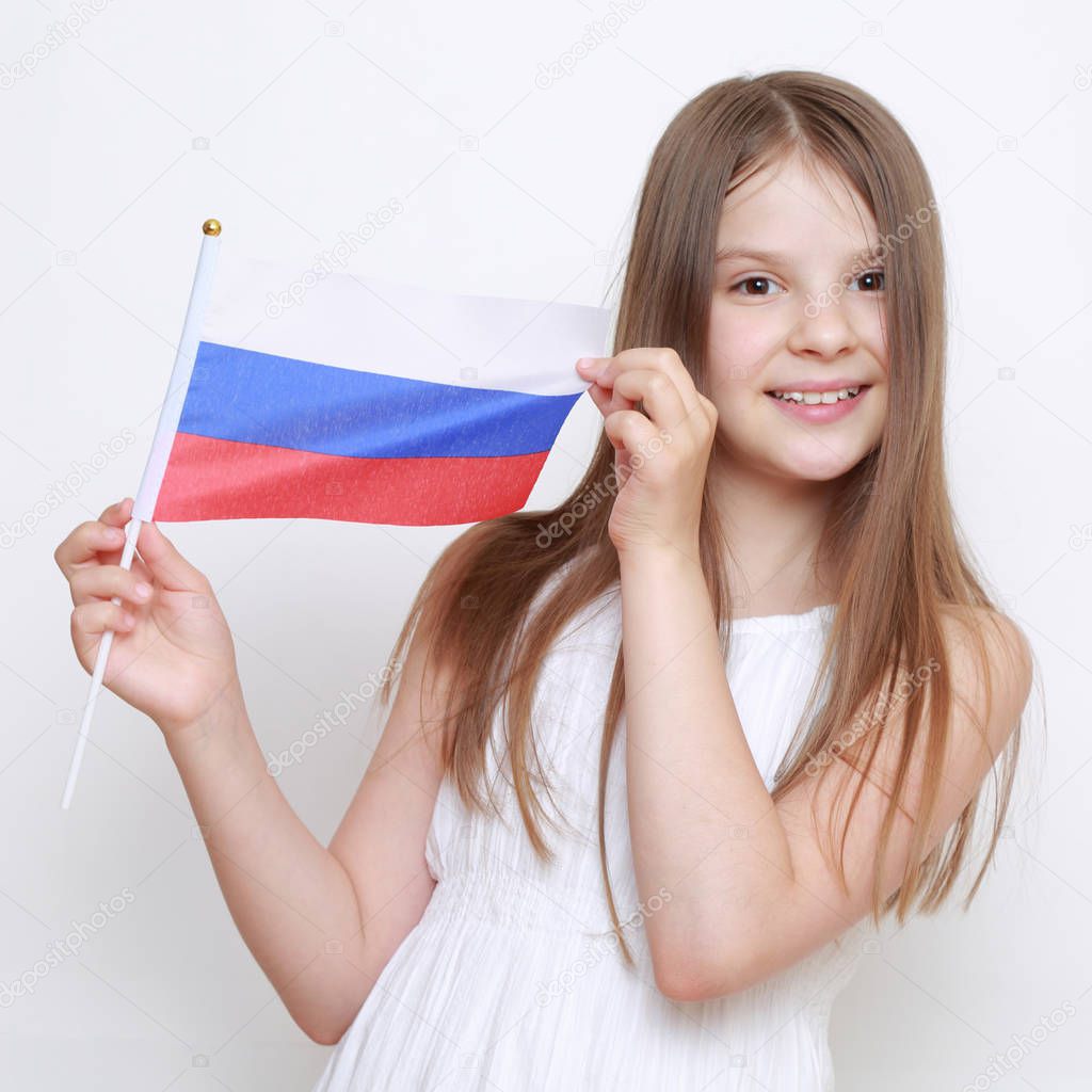 Cute little girl and Russian flag