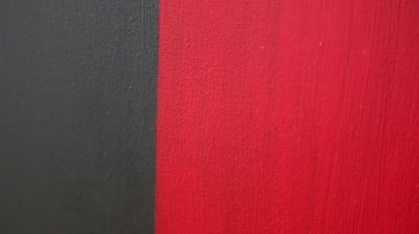 Soyut bir Çağdaş Sanat resim olarak kırmızı ve siyah akrilik dokulu arka plan. Seçili odak. Bulanıklık bokeh.