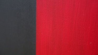 Soyut bir Çağdaş Sanat resim olarak kırmızı ve siyah akrilik dokulu arka plan. Seçili odak. Bulanıklık bokeh.