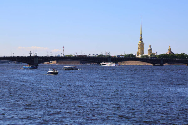 SAINT PETERSBURG, RUSSIA - JUNE 16, 2019: Beautiful view on Neva river and Peter and Paul fortress summer sunny day.