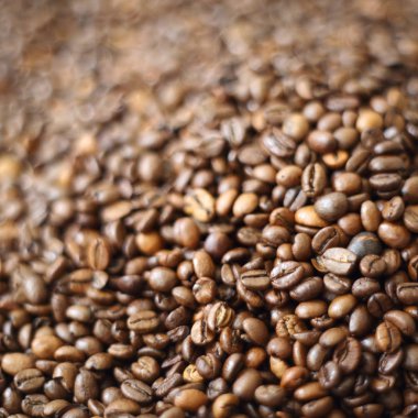 Fasulye bulanık arka planda. Defocus (ya da seçili odak) kahve dokusu. 