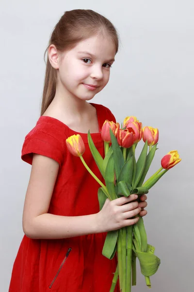 Adorable Little Girl Holding Tulips — Stock Photo, Image