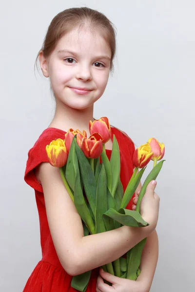 Adorable Little Girl Holding Tulips — Stock Photo, Image