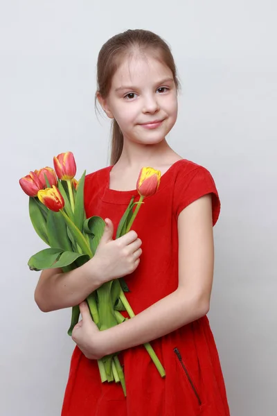 Adorable Little Girl Holding Tulips — Stock Photo, Image