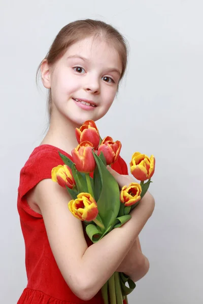 Adorable Little Girl Holding Tulips — Stock Photo, Image