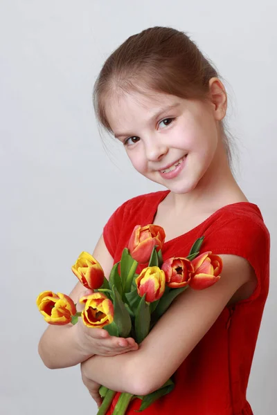 Adorable Little Girl Holding Tulips — Stock Photo, Image