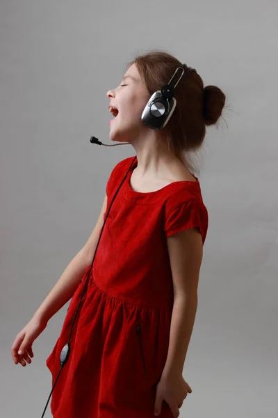 Beautiful Little Girl Red Dress Listen Music Singing — Stock Photo, Image