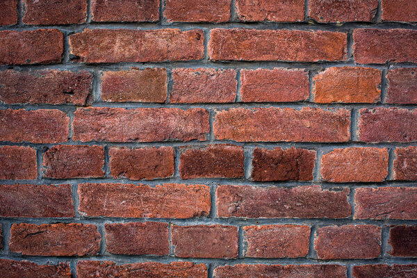 Фон стены из красного кирпича с виньеткой eccet, грандиозные ржавые блоки красочной горизонтальной архитектуры
