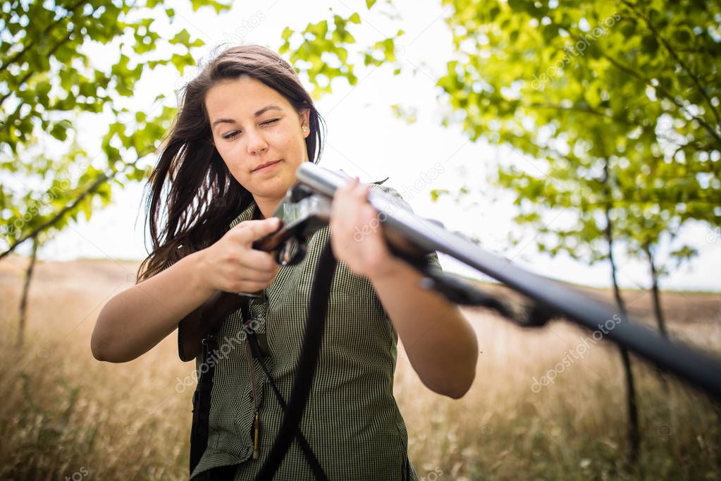 Autumn hunting season. Hunting. Outdoor sports. Woman hunter in the woods