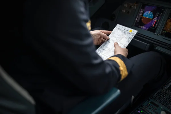 Pilot\'s hand accelerating on the throttle in  a commercial airliner airplane flight cockpit during takeoff