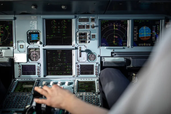 Pilot\'s hand accelerating on the throttle in  a commercial airliner airplane flight cockpit during takeoff