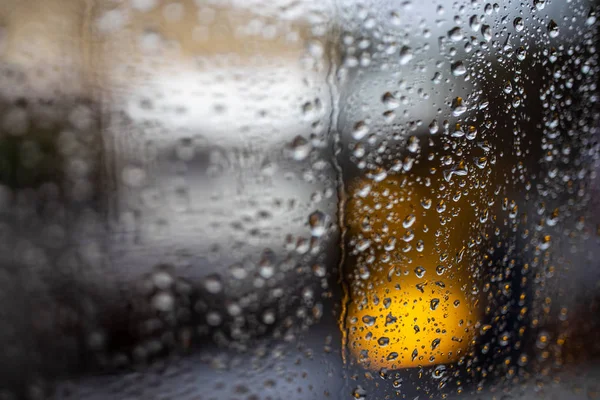 Rainy afternoon city  street through a window — Stock Photo, Image