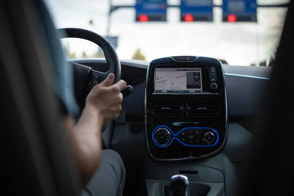 Young man driving an electric vehicle — Stock Photo, Image