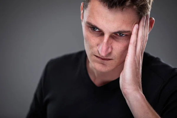 Fear/anxiety/regret/uncertainty in a young man — Stock Photo, Image