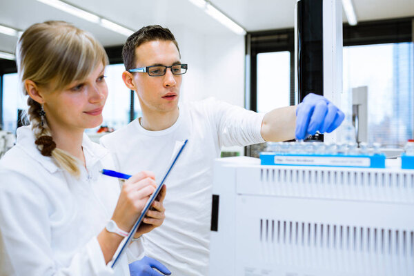 senior male researcher carrying out scientific research in a lab