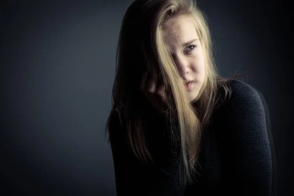 Young woman suffering from a severe stomach pain/depression — Stock Photo, Image