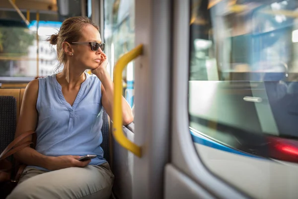 Young woman on a city tram, — Stock Photo, Image