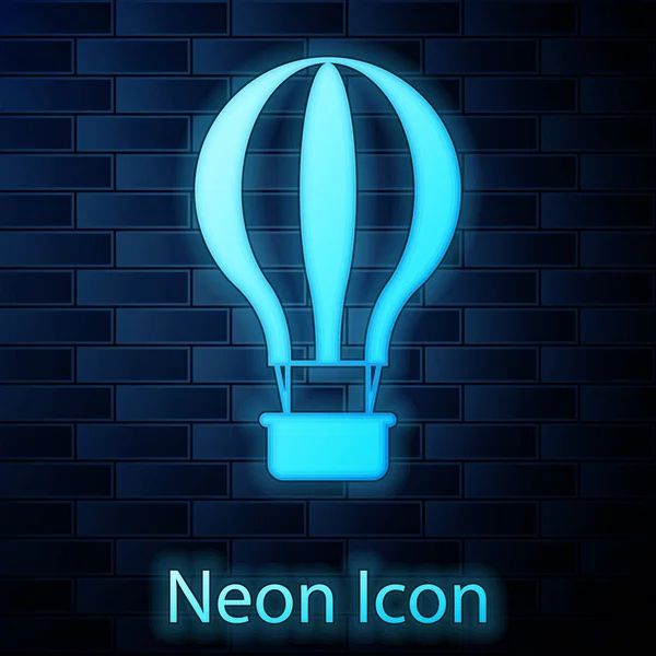 Zářící neon horkovzdušný balón ikona izolované na cihlovou zeď na pozadí. Letecká doprava pro cestování. Vektorové ilustrace — Stockový vektor