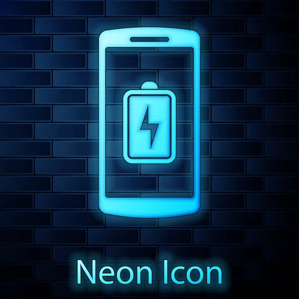 Glowing neon Smartphone battery charge icon isolated on brick wall background. Phone with a low battery charge. Vector Illustration — Stock Vector