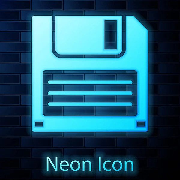 Svítící neonová disketa pro počítačovou datovou ikonu izolovaná na pozadí cihlové zdi. Značka diskety. Vektorová ilustrace — Stockový vektor