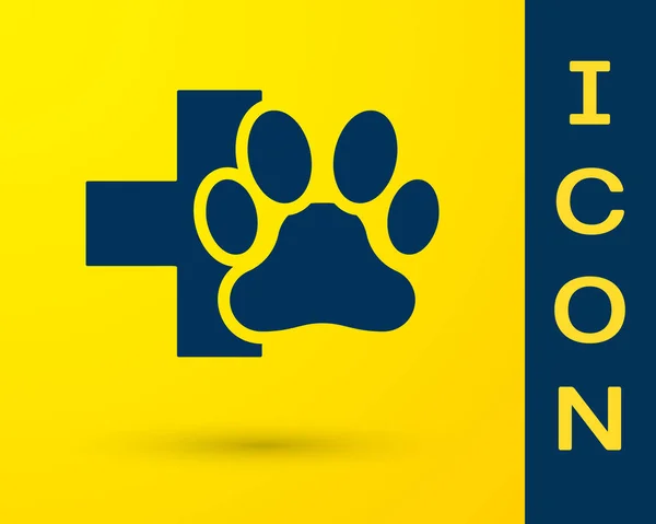 Blue Veterinary clinic symbol icon isolated on yellow background. Cross hospital sign. A stylized paw print dog or cat. Pet First Aid sign. Vector Illustration