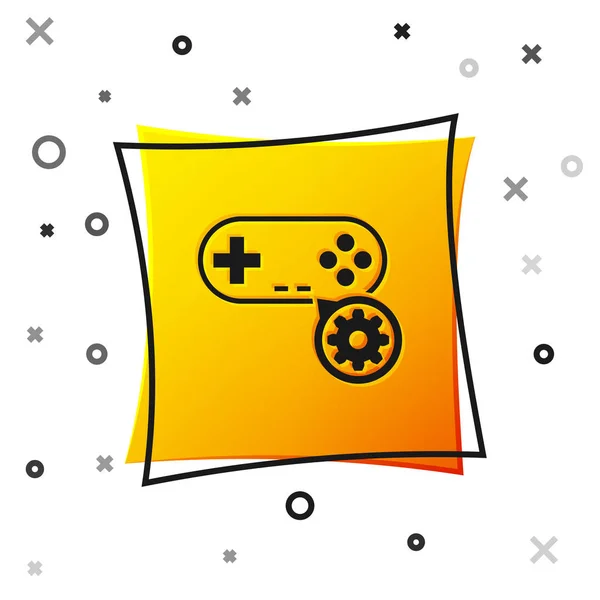 Gamepad noir et icône d'engrenage isolé sur fond blanc. Réglage app, concept de service, options de réglage, entretien, réparation, réparation. Bouton carré jaune. Illustration vectorielle — Image vectorielle