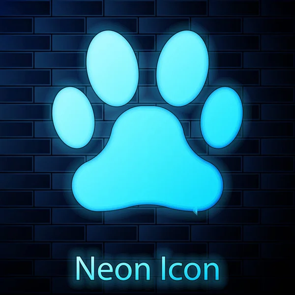 Glowing neon Paw print icon isolated on brick wall background. Dog or cat paw print. Animal track. Vector Illustration