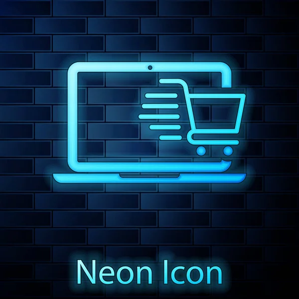 Glödande neon Shopping vagn på skärmen laptop ikon isolerad på tegelvägg bakgrund. Begreppet e-handel, e-affärer, marknadsföring online. Vektor Illustration — Stock vektor