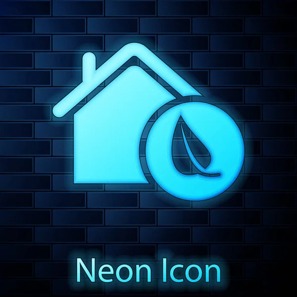 Glowing neon Eco friendly house icon isolated on brick wall background. Eco house with leaf. Vector Illustration