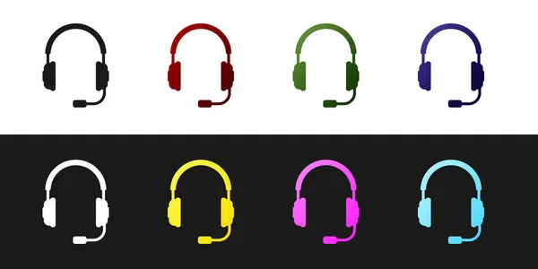 Set Auriculares con icono de micrófono aislado sobre fondo blanco y negro. Signo de auriculares. Objeto conceptual para escuchar música, servicio, comunicación y operador. Ilustración vectorial — Vector de stock