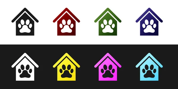 Встановити собачий будинок і лапу друкувати піктограму домашньої тварини ізольовано на чорно-білому тлі. Собачий розплідник. Векторна ілюстрація — стоковий вектор