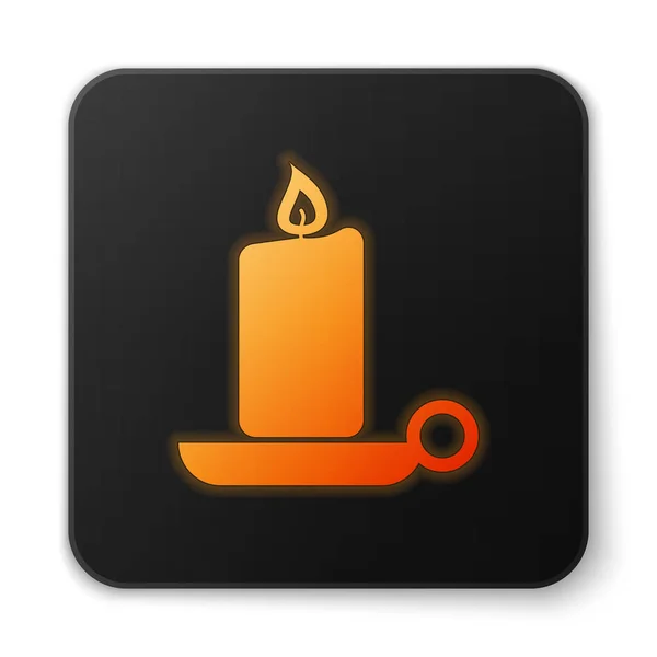 Orange glowing Burning candle in candlestick icon isolated on white background. Old fashioned lit candle. Cylindrical aromatic candle stick with burning flame. Black square button. Vector Illustration — Stock Vector