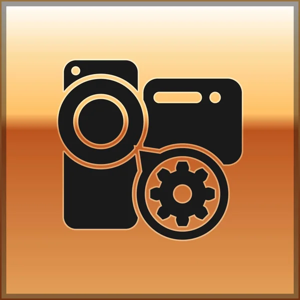 Icono de cámara de vídeo y engranaje negro aislado sobre fondo dorado. Ajustar la aplicación, concepto de servicio, opciones de configuración, mantenimiento, reparación, fijación. Ilustración vectorial — Vector de stock