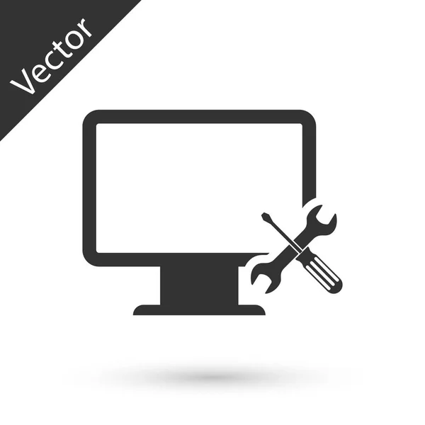 Monitor de ordenador gris con destornillador e icono de llave inglesa aislado — Vector de stock