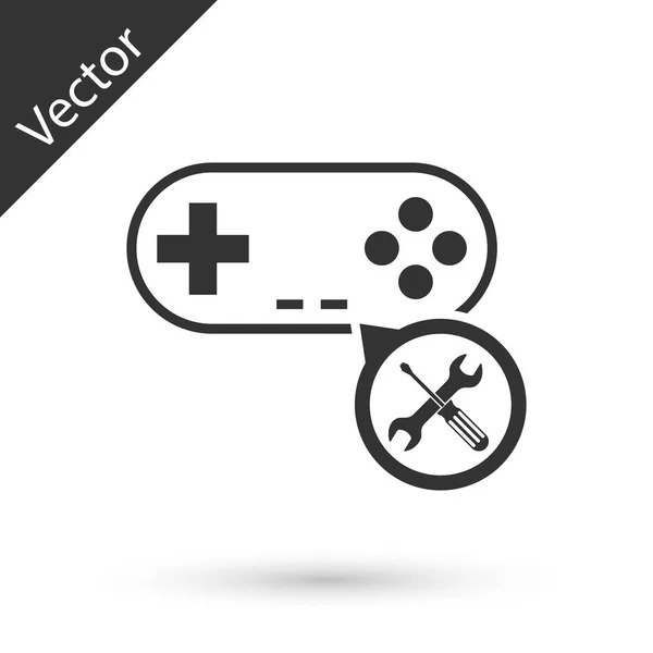 Graues Gamepad mit Schraubenzieher und Schraubenschlüssel-Symbol isoliert auf weiß — Stockvektor