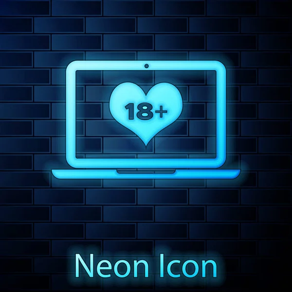 Glowing neon Laptop computer with 18 plus content heart icon isolated on brick wall background. Age restriction symbol. 18 plus content sign. Adult channel. Vector Illustration — Stock Vector